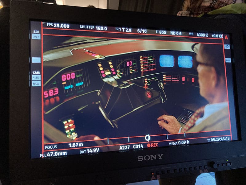 Actor Christian Tramitz looking at the Dashboard of KITT in TV Series Ze Network